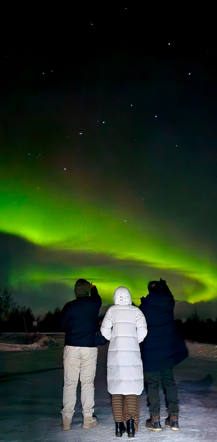 Spectacular aurora over Kiruna mountain landscape